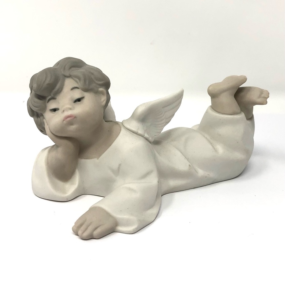 Vintage Lladro bisque porcelain boy angel lying down figurine
